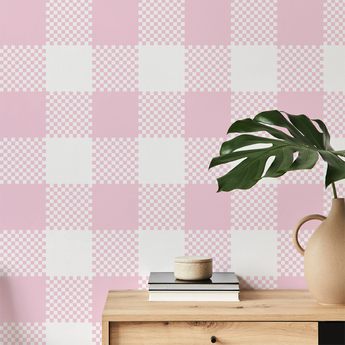 valentine pink plaid wallpaper on a hallway wall with an oak console table and monstera